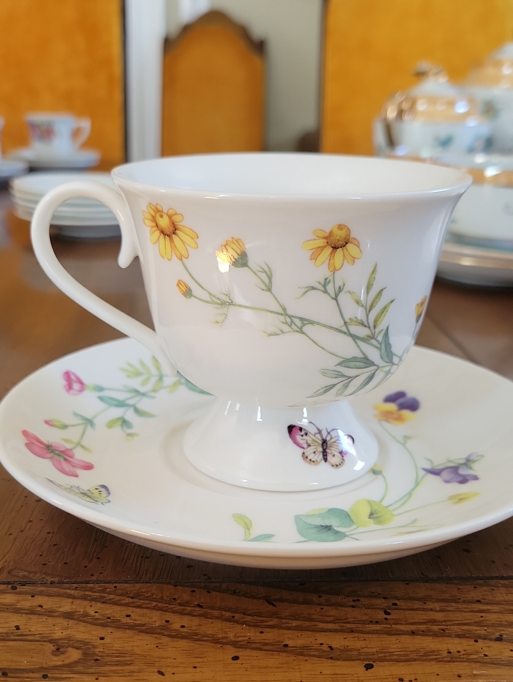 Fine Porcelain Floral Pedestal Teacup and Saucer - Yellow Floral